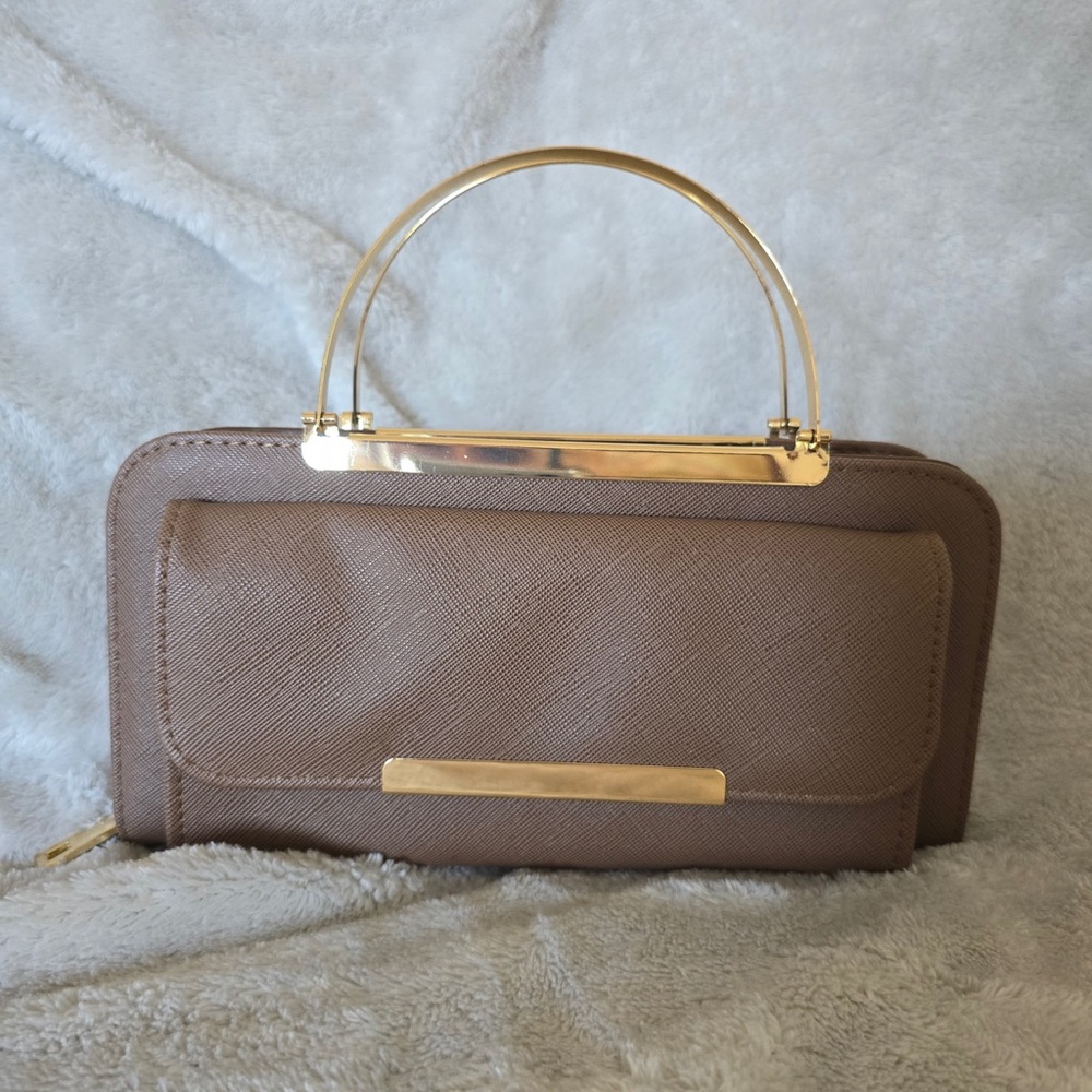 Taupe faux leather handbag with gold handle, and strap for crossbody option.